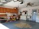 Garage with wooden cabinets, workbench, and a utility sink at 10337 Se 176Th St, Summerfield, FL 34491