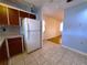 Kitchen with wood cabinets and refrigerator at 10337 Se 176Th St, Summerfield, FL 34491