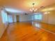 Living room with hardwood floors and chandelier at 10337 Se 176Th St, Summerfield, FL 34491