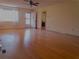 Living room with hardwood floors, ceiling fan and access to other rooms at 10337 Se 176Th St, Summerfield, FL 34491