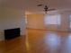 Bright living room with hardwood floors and large window at 10337 Se 176Th St, Summerfield, FL 34491