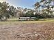 Wooden boat dock with covered area at 105 Royal Palm Dr, Leesburg, FL 34748