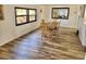 Dining room featuring hardwood floors and a wood dining table at 105 Royal Palm Dr, Leesburg, FL 34748