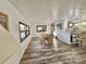 Bright dining room with wood table and chairs, hardwood floors at 105 Royal Palm Dr, Leesburg, FL 34748