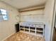 Laundry room with shelving and cabinets at 105 Royal Palm Dr, Leesburg, FL 34748