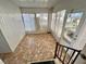 Sunroom with tiled floor and access to outdoors at 105 Royal Palm Dr, Leesburg, FL 34748