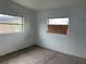 Empty bedroom with two windows and neutral walls at 1121 Oakland Dr, Tavares, FL 32778