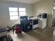 A laundry room with a washer, dryer, and microwave at 1121 Oakland Dr, Tavares, FL 32778