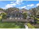 Stunning home with a large pool, patio, and private waterfront access at 11644 Osprey Pointe Blvd, Clermont, FL 34711