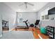 Home gym featuring treadmill, rowing machine, and weights at 11644 Osprey Pointe Blvd, Clermont, FL 34711