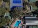 Aerial view of pool, tennis, shuffleboard, and greenhouse at 12163 Se 176Th Loop, Summerfield, FL 34491