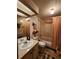 Clean bathroom with tub, shower, and double vanity at 128 Lake Hazel Dr, Winter Haven, FL 33884