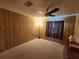 Simple bedroom with carpeted floor and ceiling fan at 128 Lake Hazel Dr, Winter Haven, FL 33884