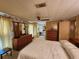 Bright bedroom with ensuite bathroom access and dresser at 128 Lake Hazel Dr, Winter Haven, FL 33884