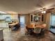 Dining area with a wood table and chairs, adjacent to the kitchen at 128 Lake Hazel Dr, Winter Haven, FL 33884