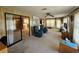Sunroom featuring relaxing seating and access to kitchen at 128 Lake Hazel Dr, Winter Haven, FL 33884