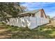 Home's fenced backyard with green grass at 1313 Vine St, Leesburg, FL 34748