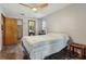 Bright bedroom with wood-look floors and ceiling fan at 1313 Vine St, Leesburg, FL 34748