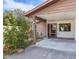 Front view of the house featuring a covered entryway and landscaping at 1313 Vine St, Leesburg, FL 34748