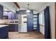 Modern kitchen with dark blue cabinets, stainless steel appliances and marble countertops at 1313 Vine St, Leesburg, FL 34748