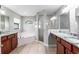 Bathroom featuring double vanities, a soaking tub, and a glass-enclosed shower at 13819 Sw 109Th Ln, Dunnellon, FL 34432