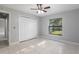 A bedroom with bright, natural light coming in from the large window at 13819 Sw 109Th Ln, Dunnellon, FL 34432