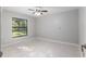 A bright and airy bedroom with ceramic tile and a large window at 13819 Sw 109Th Ln, Dunnellon, FL 34432