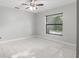 A bright and airy bedroom with ceramic tile and a large window at 13819 Sw 109Th Ln, Dunnellon, FL 34432