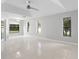 Bright and airy bedroom featuring tile floors and ample natural light from several windows at 13819 Sw 109Th Ln, Dunnellon, FL 34432