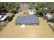 Aerial view of the home showcasing lush landscaping, new roof, and proximity to nature at 1511 Moss Ave, Leesburg, FL 34748