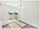 Bright dining area with sliding glass doors leading to the backyard at 1511 Moss Ave, Leesburg, FL 34748