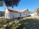 View of the house's rear and side, showing the pool equipment at 16154 Magnolia Hill St, Clermont, FL 34714