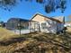 Back of house, showcasing the pool and screened enclosure at 16154 Magnolia Hill St, Clermont, FL 34714