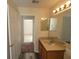 Clean bathroom with updated vanity and mirror at 16154 Magnolia Hill St, Clermont, FL 34714