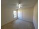 Simple bedroom with large window and closet at 16154 Magnolia Hill St, Clermont, FL 34714