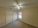 Bright bedroom with double closets and ceiling fan at 16154 Magnolia Hill St, Clermont, FL 34714