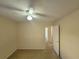 Spacious bedroom with door leading to hallway at 16154 Magnolia Hill St, Clermont, FL 34714