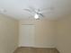 Simple bedroom with double door closet and ceiling fan at 16154 Magnolia Hill St, Clermont, FL 34714