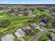 Community overview with golf course and house location highlighted at 1711 Lilly Ln, The Villages, FL 32159