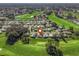 Aerial view of home on golf course community at 1711 Lilly Ln, The Villages, FL 32159