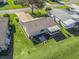 Aerial view of house and surrounding landscape at 1711 Lilly Ln, The Villages, FL 32159