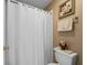 Simple bathroom with shower/tub combo and neutral color palette at 1711 Lilly Ln, The Villages, FL 32159