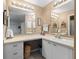 Clean bathroom with double vanity and updated fixtures at 1711 Lilly Ln, The Villages, FL 32159