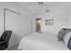 Well-lit bedroom with a queen bed and built in closet at 1711 Lilly Ln, The Villages, FL 32159