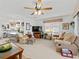 Bright living room with an open floor plan and kitchen view at 1711 Lilly Ln, The Villages, FL 32159