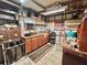 Large workshop with ample storage and workbenches at 180 Hibiscus Way, Leesburg, FL 34748