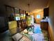 Cozy dining area with glass-top table and built-in shelving at 1803 Ne 29Th Pl, Ocala, FL 34479