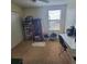 Bright bedroom with window, closet, and workspace at 2287 Victoria Dr, Davenport, FL 33837