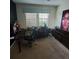 Home office with large artwork, desk and comfortable chair at 2287 Victoria Dr, Davenport, FL 33837