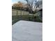 Backyard view of a new privacy fence, concrete patio and mature landscaping at 24450 Ne 127Th St, Salt Springs, FL 32134